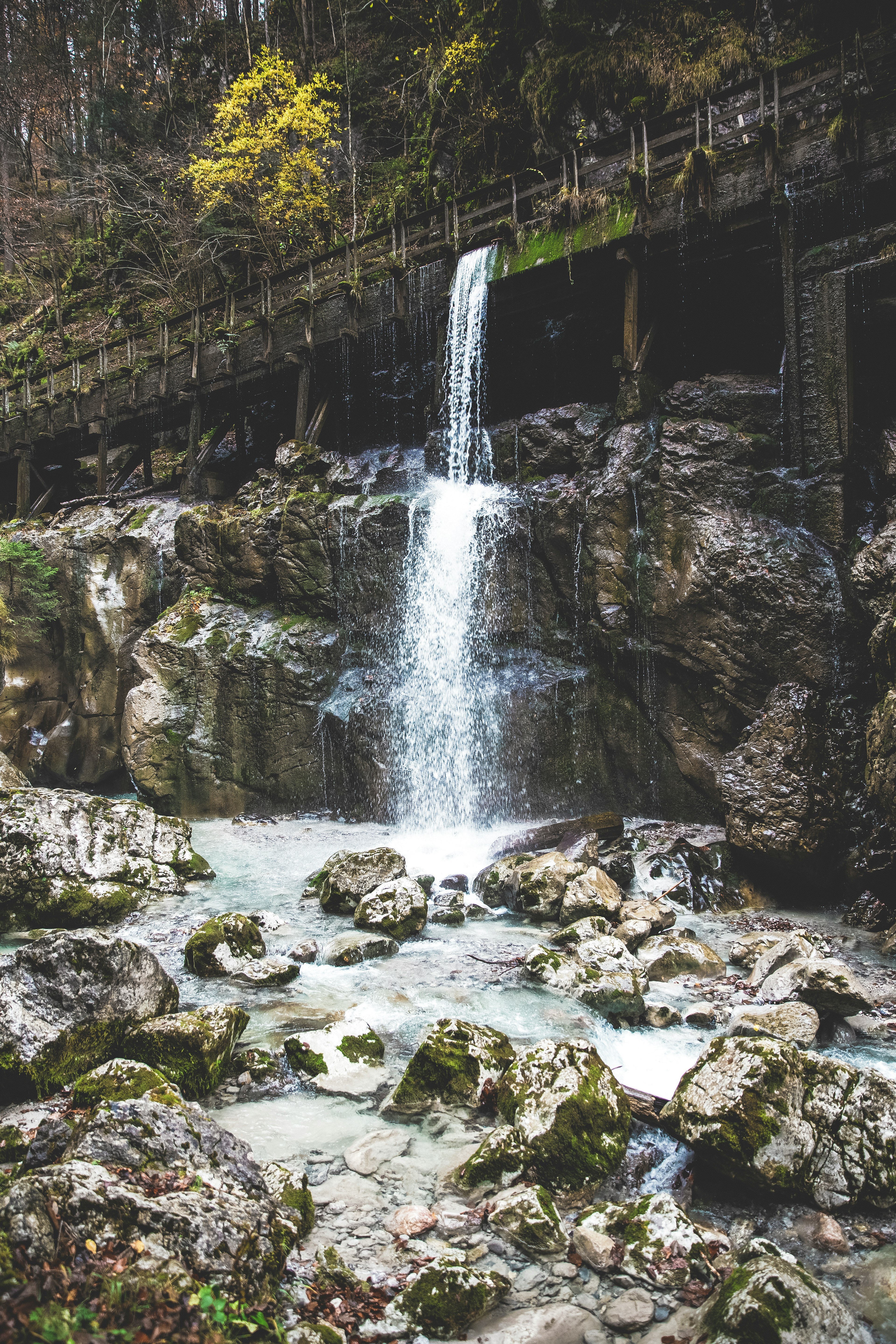 flowing water under bridge